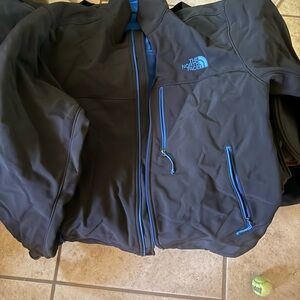 The North Face Men's Black Jacket with Vibrant Blue Accents